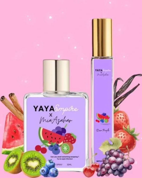 Dua botol perfume Yaya Empire x Mia Azahar Dino Purple berlabel ilustrasi buah-buahan